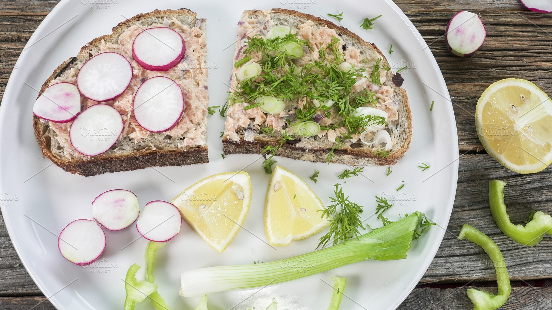 Sliced bread topped with trout, herb, a Food & Drink Photo by 1miromiro