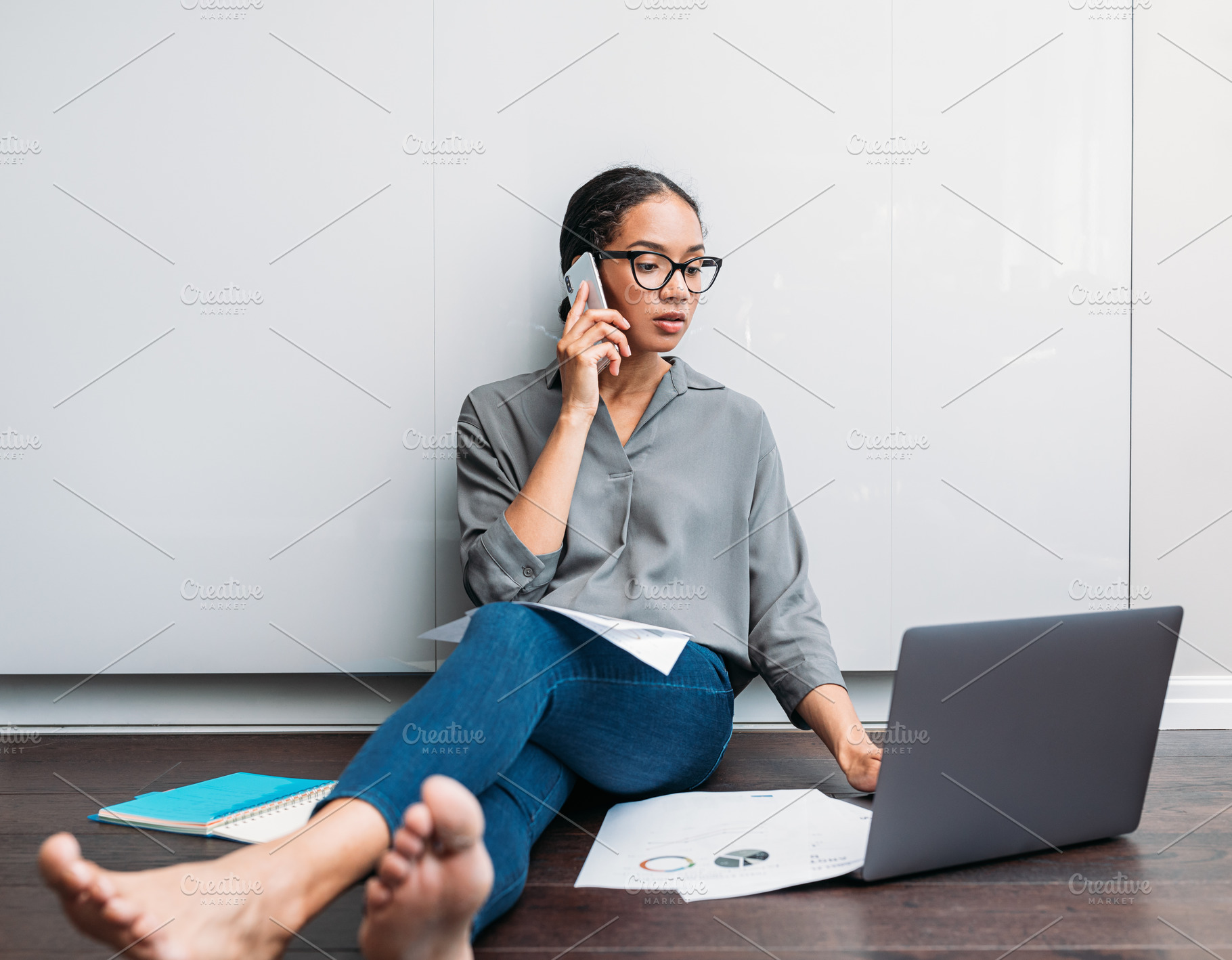 Young female using a laptop and talk, a Business Photo by Artem Varnitsin