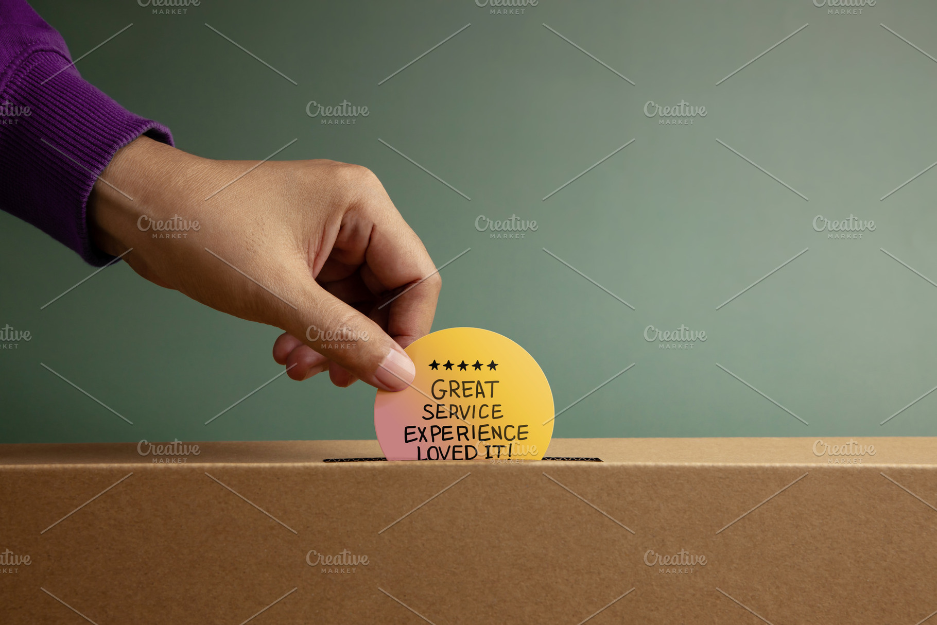 Hand putting Customer Service Experience Review card in box symb, a Photo by salmon.black