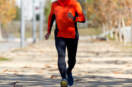 Senior man running outdoors in sportswear