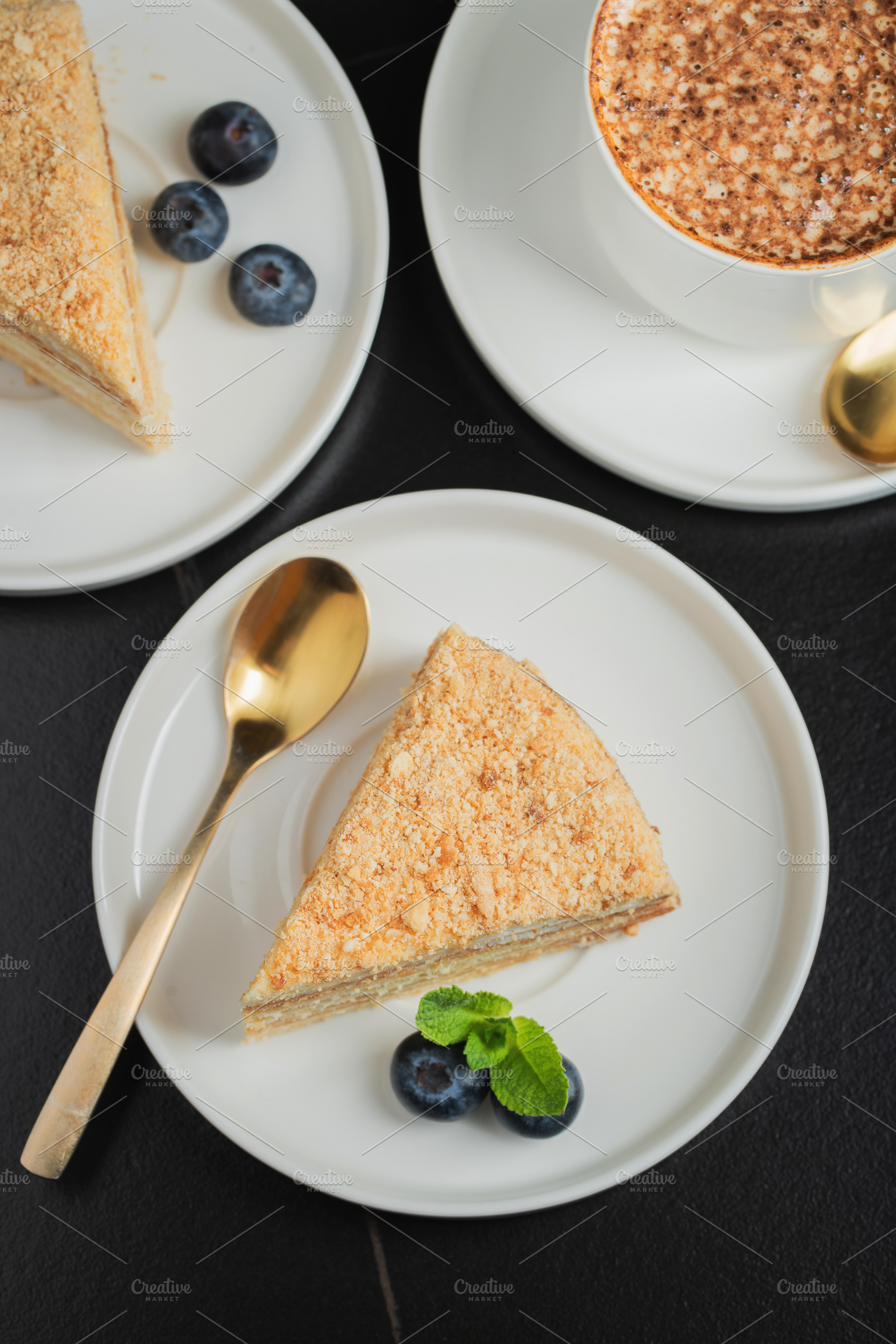 Medovik. Honey cake made from honey cakes with whipped sour cream, decorated wi, a Food & Drink Photo by Budarinphoto