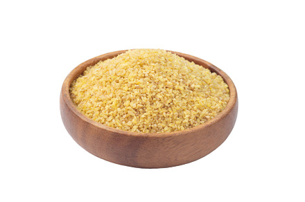 Bulgur in wooden bowl, isolated on white, a Food & Drink Photo by iuliia_n