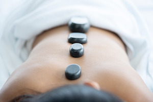 Asian Woman Have a Hot Stone Massage