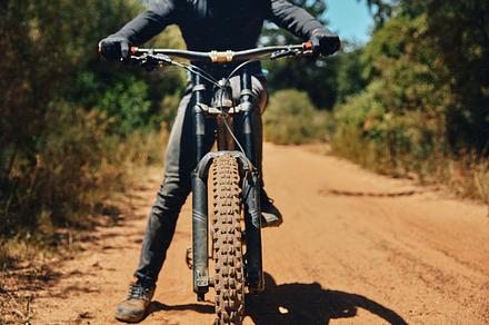 Mountain bike, person on path and fitness outdoor, ready for cycling and extreme sports with biking and exercise. Workout, riding in nature with bicycle and athlete, training for race with cyclist, a Photo by Peopleimages.com