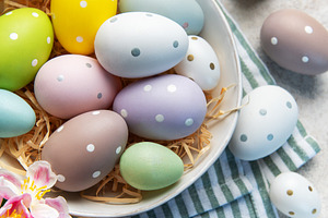 Pastel easter eggs in a bowl with spring flowers, a Holiday Photo by Olena Rudo