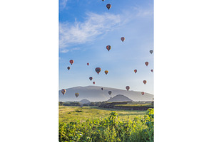 Colorful hot air balloons floating, a Sports & Recreation Photo by Elizaveta Galitskaya