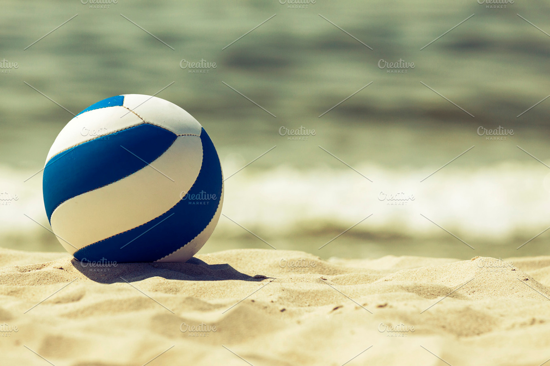 Retro looking ball on the beach, a Holiday Photo by BOOCYS