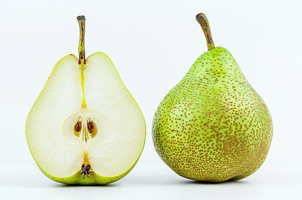 Green pear and pear half isolated on white background, a Food & Drink Photo by AlyaAnd