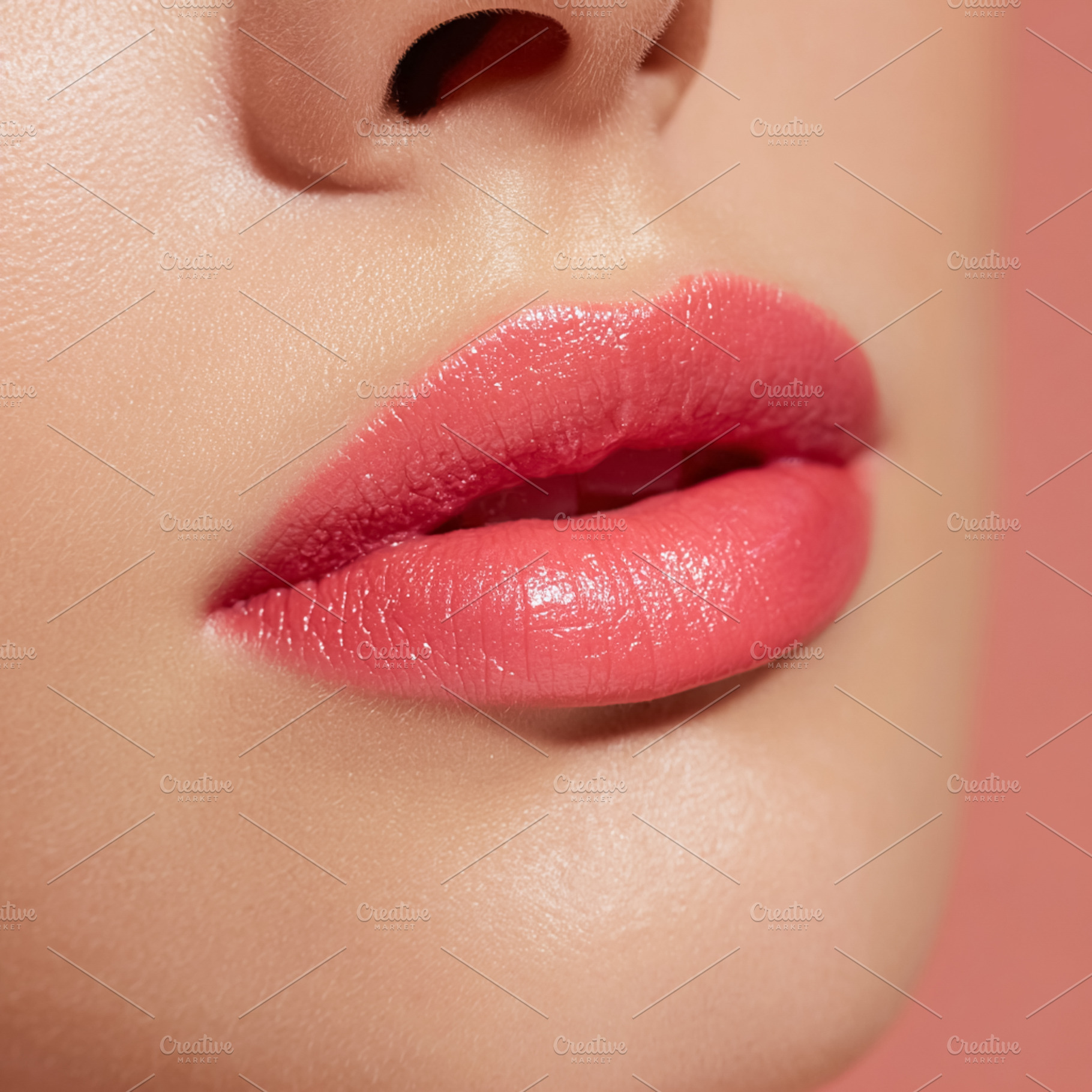 Woman's glossy pink lips close up showcasing beauty, cosmetic ap, a Photo by Studio ANNA