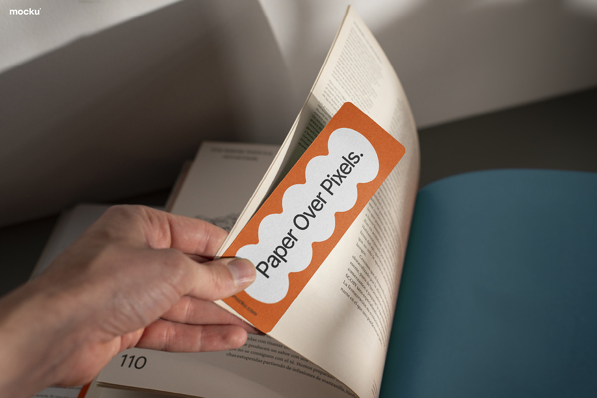 Hand Holding Bookmark Mockup, a Books & Magazine Mockup by Mocku (Photo 1 of 2)