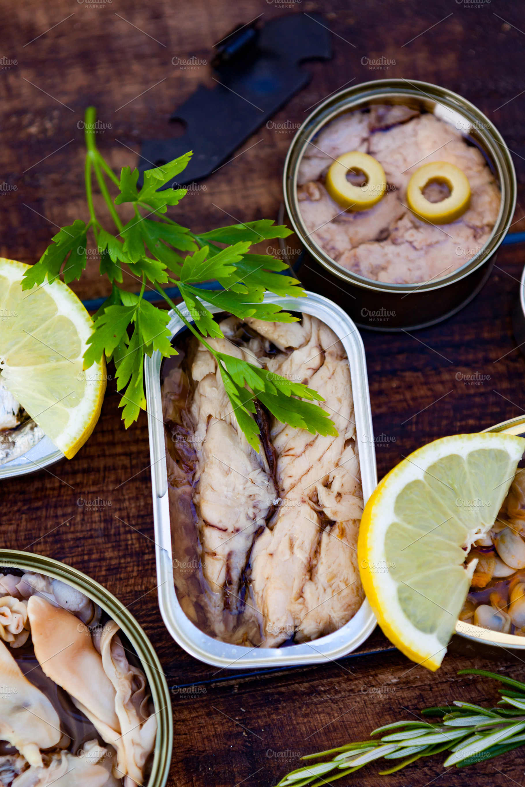 Cans of preserves. In the center a can of mackerel in oil, a Food & Drink Photo by José Manuel Gelpi