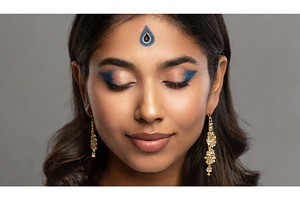A serene woman with artistic blue, a Beauty & Fashion Photo by Igor Tichonow