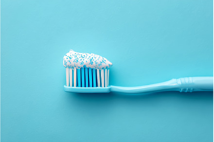 Toothpaste is applied to a blue, a Health & Medical Photo by ZinetroN