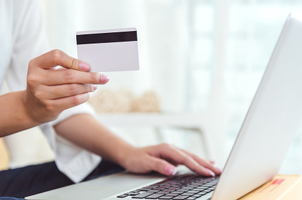 Woman hands holding credit card for online shopping or ordering, a Business Photo by Ministocker