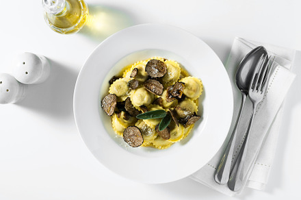 Italian ravioli with butter, parmesan cheese and truffle on the