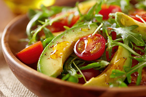 Fresh salad with cherry tomatoes and avocado, a Food & Drink Photo by AlyaAnd