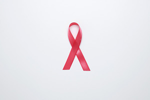 Pink ribbon representing awareness and prevention of breast cancer, a Photo by matucha