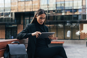 Confident businesswoman in black, a Business Photo by Artem Varnitsin