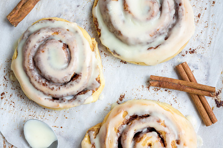 Homemade cinnabons cinnamon rolls wi containing dessert, cream, and food, a Food & Drink Photo by iuliia_n