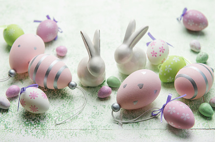 Decorative rabbits and  Easter eggs on the table, a Holiday Photo by Olena Rudo