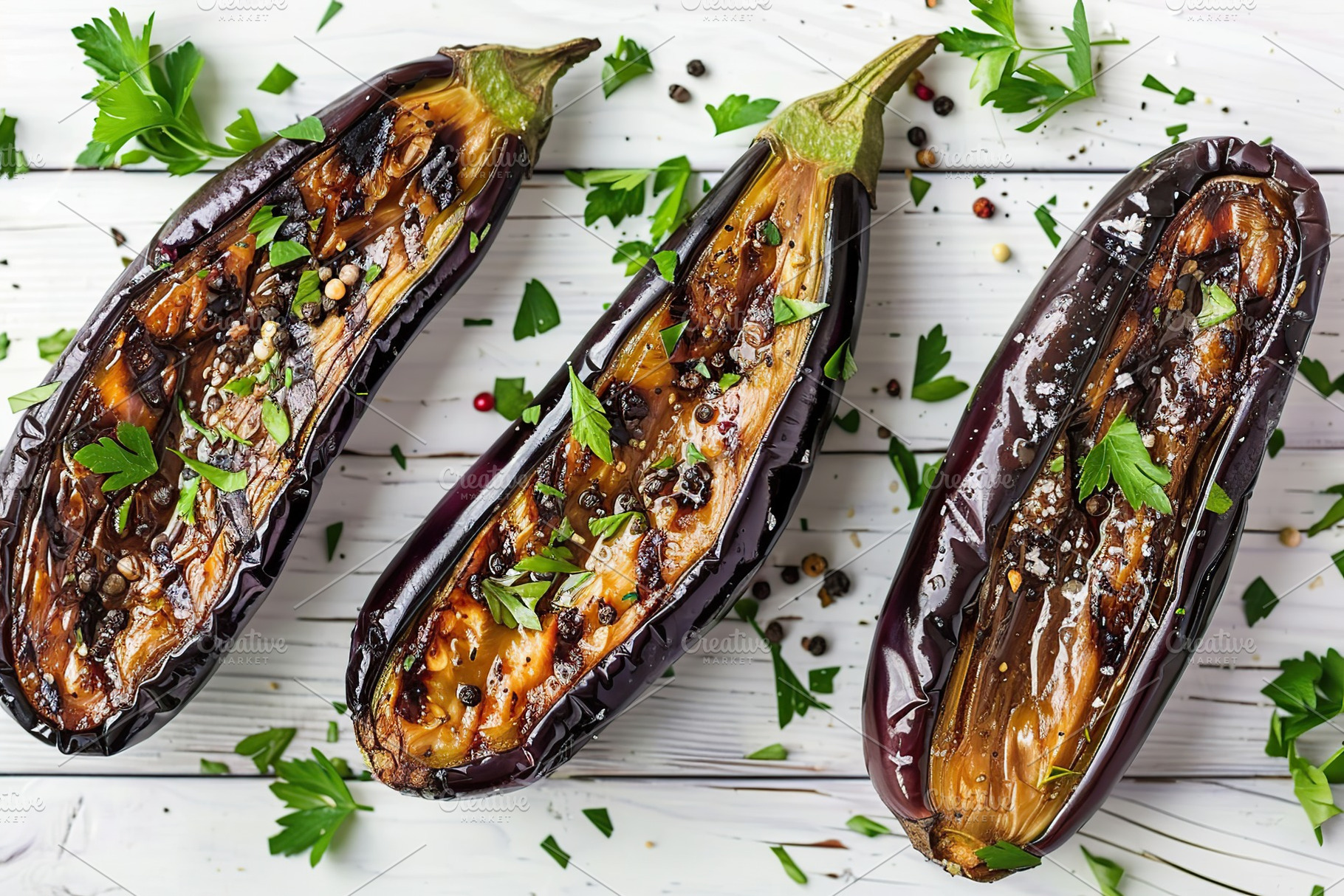 Baked eggplants on white wooden table, a Food & Drink Photo by AlyaAnd