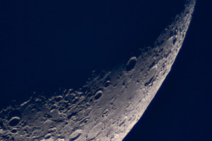 Detailed crescent moon against dark, a Wallpaper Photo by Elena Vagengeim