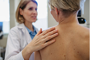 Radiologist comforting patient, a Person Photo by HalfPoint