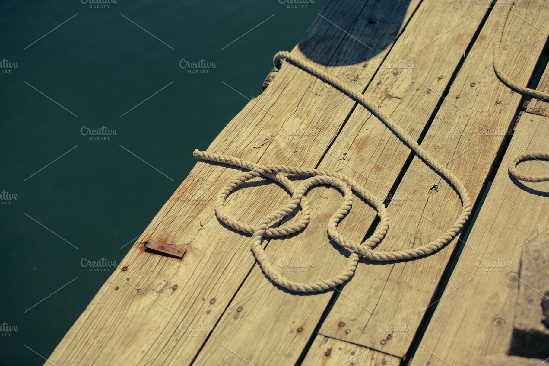 Dock rope containing dock, rope, and boards