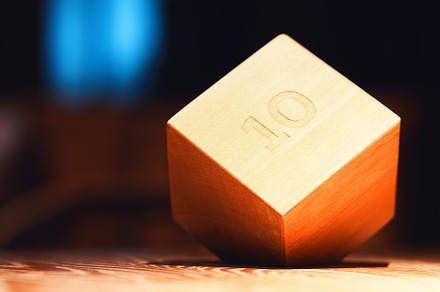 Wooden brick with number 10 on wooden table object background