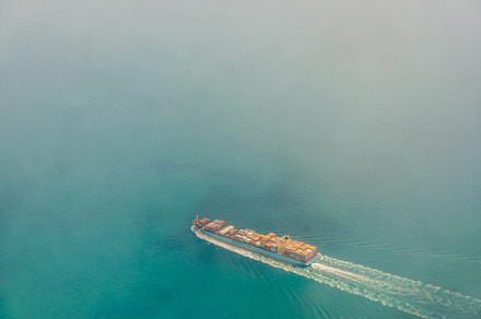 Cargo ship containing ship, ocean, and aerial