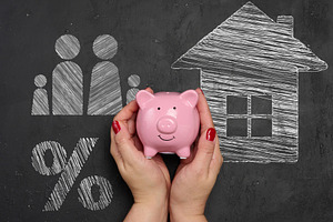 A woman's hands carefully hold a pink ceramic piggy bank against, a Business Photo by ndanko