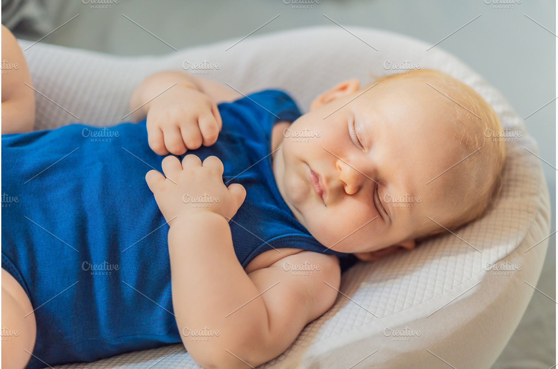 Chubby 3-month-old baby peacefully, a Person Photo by Elizaveta Galitskaya