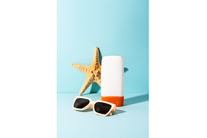 Sunglasses, sunscreen and sea shell, a Holiday Photo by Nadia-nb