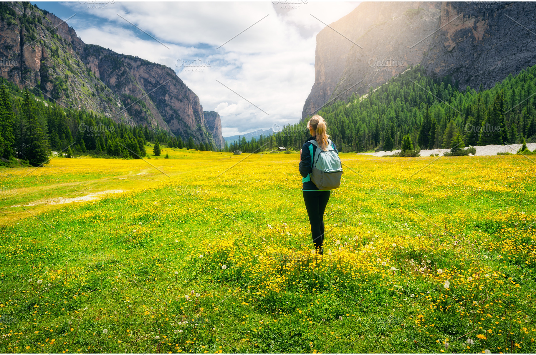 Girl with backpack on the meadow, a Person Photo by den-belitsky