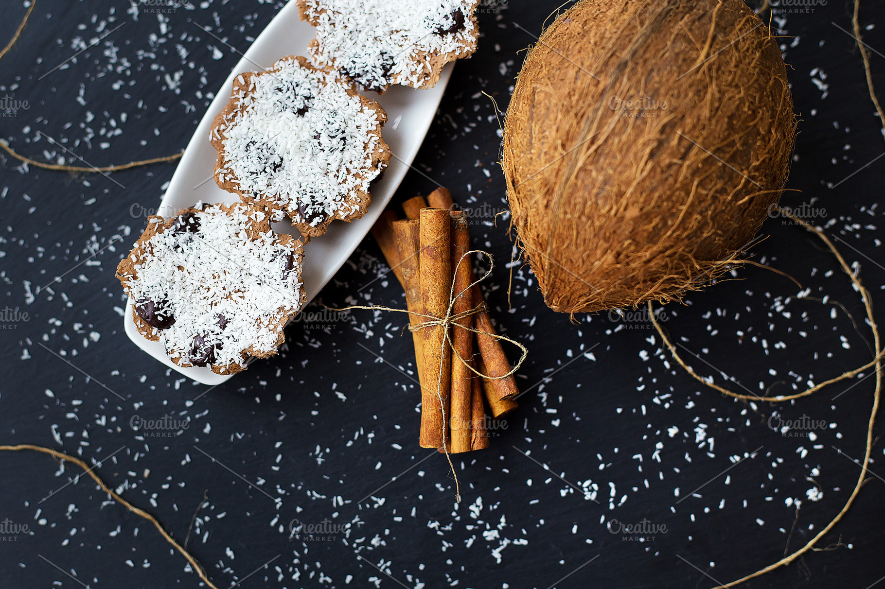 coconut muffins on a black background, a Food & Drink Photo by Artsaba Family
