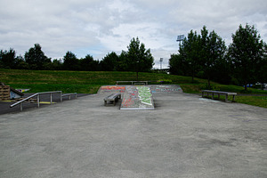 Urban skate park in Reykjavik, Iceland surrounded by greenery and open space, a Photo by AS photostudio