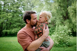Loving father helping to injured, a Health & Medical Photo by HalfPoint