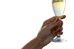 Isolated image of woman arm raising a champagne glass, a Food & Drink Photo by DanFLCreativo