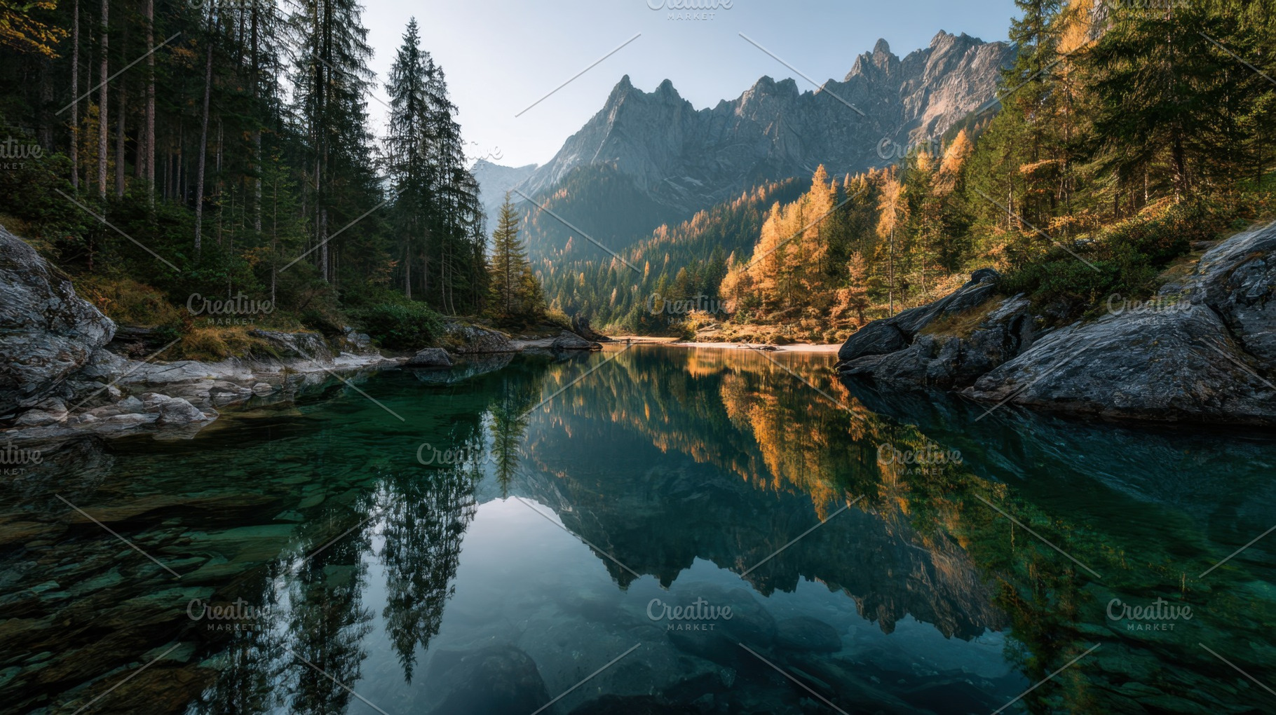 Lake mirrors trees and rocks, a Photo by Beautiful things