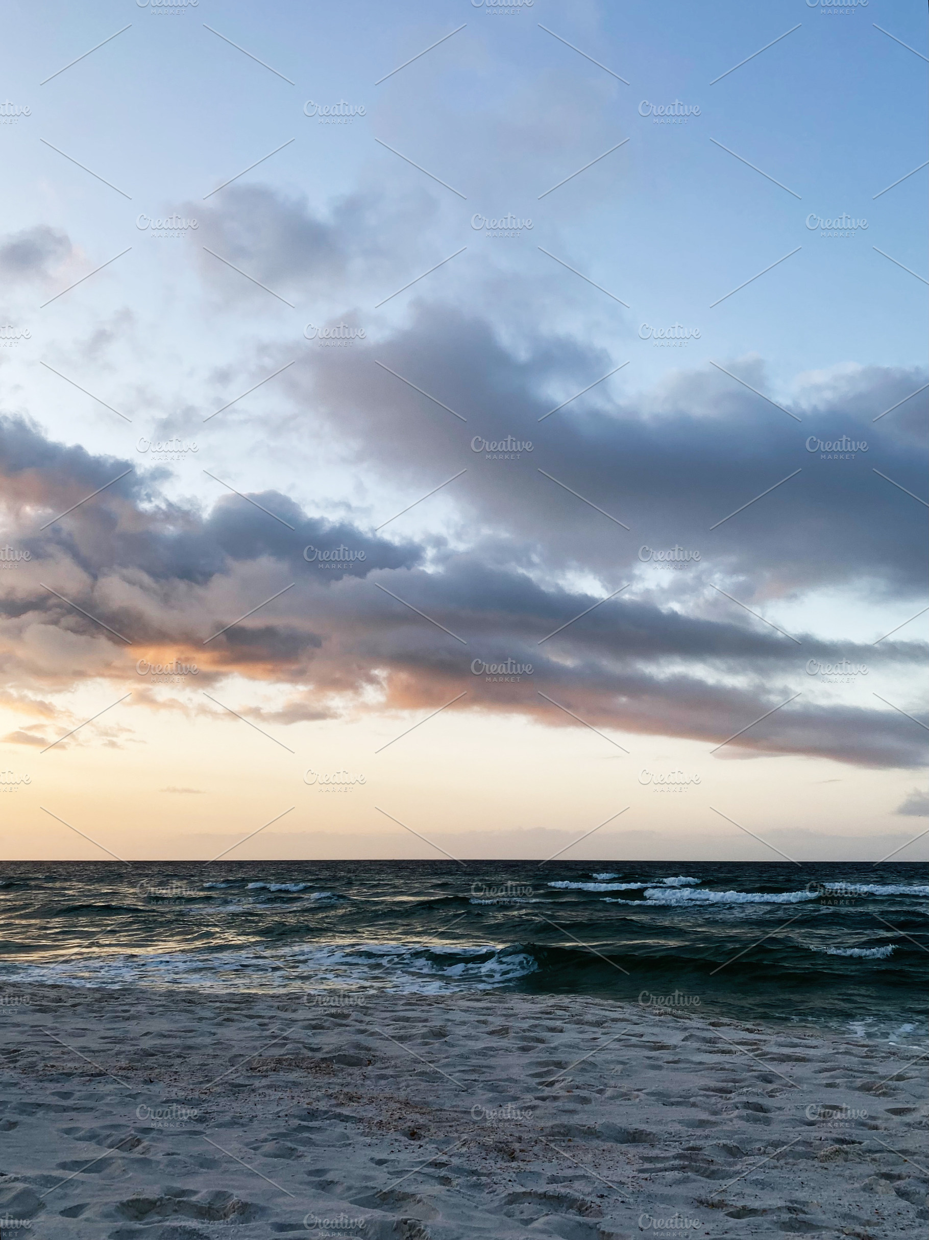 Sunset over a calm Florida Pensacola beach with gentle waves, soft clouds, and, a Nature Photo by AS photostudio
