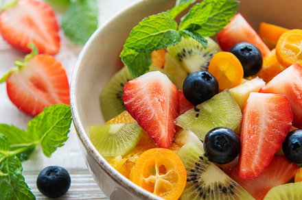 Healthy fresh fruit salad in a bowl, a Food & Drink Photo by Olena Rudo
