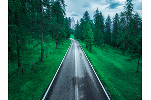 Aerial view of a winding asphalt, a Transportation Photo by den-belitsky