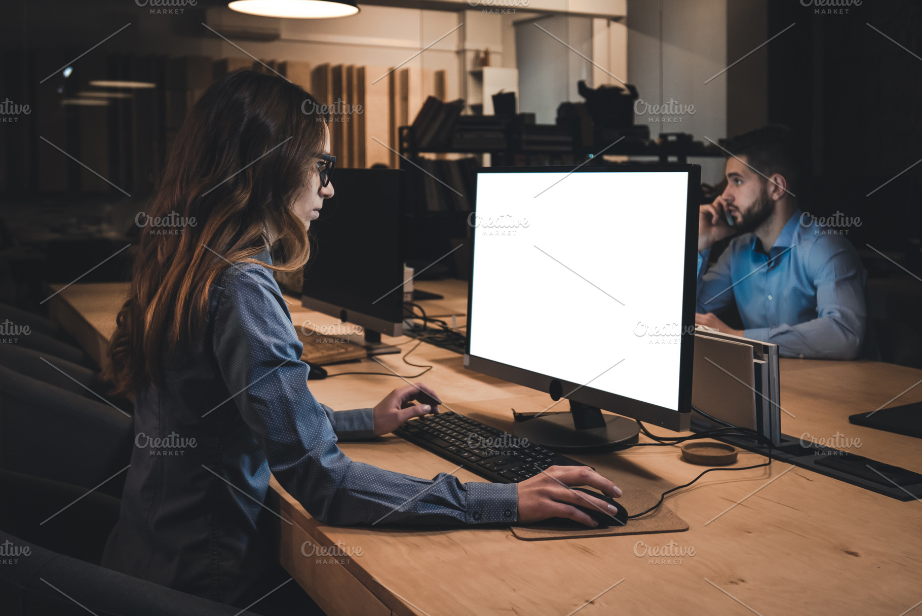 Colleagues working late in office stock photo containing office and work, a Business Photo by supamotion