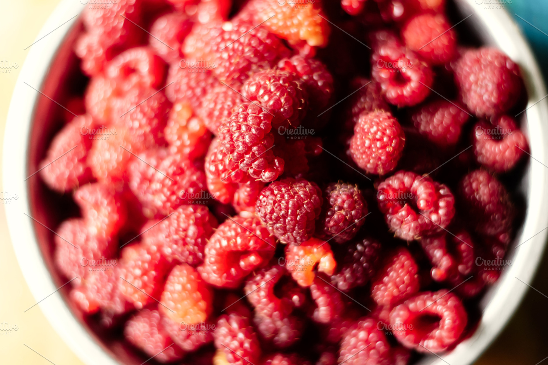 Close-up of raspberries in a bowl. B, a Food & Drink Photo by Oleksandr Masnyi