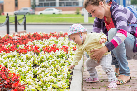 Baby first steps with mom stock photo containing mom and cute