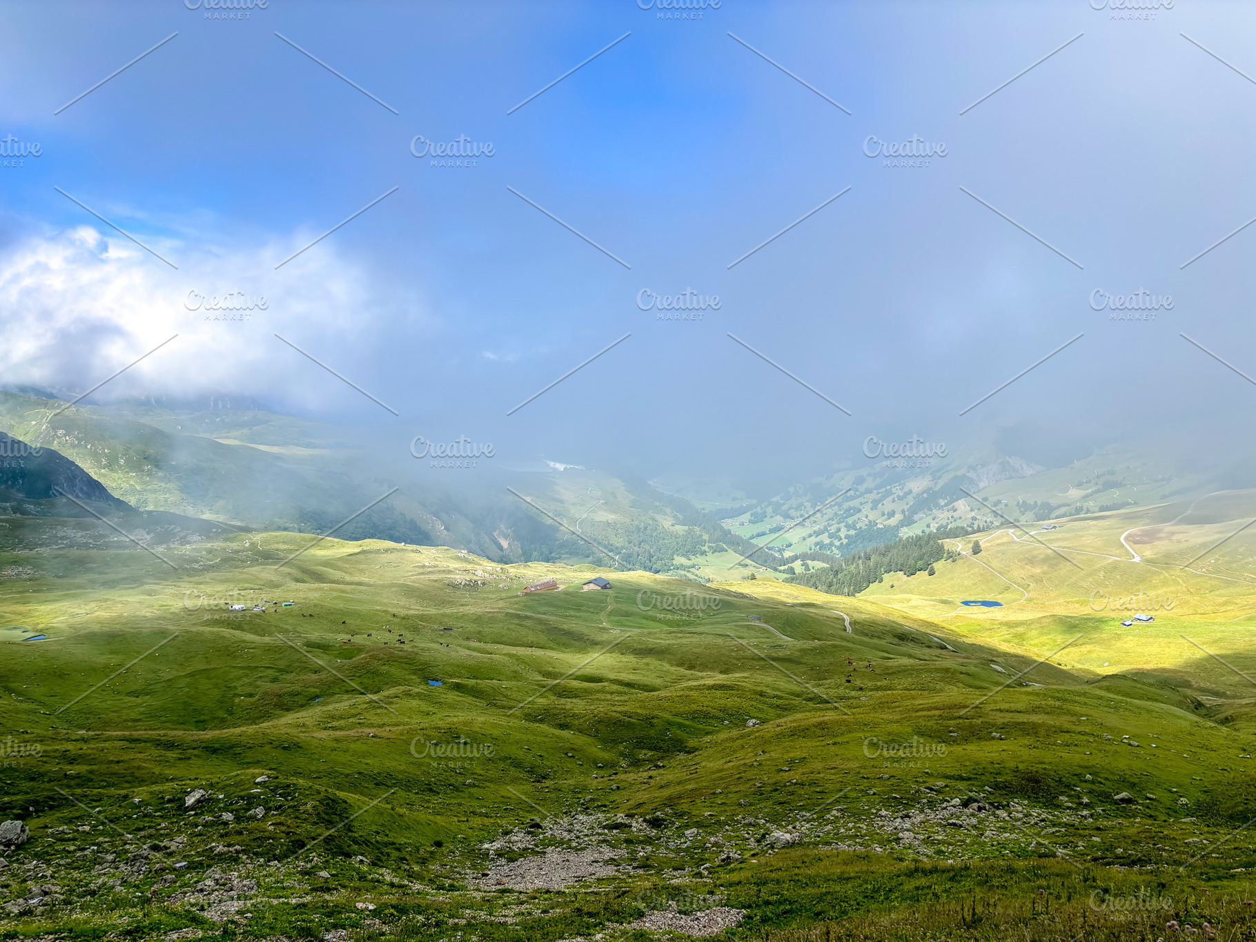 Foggy valley with green pastures in Les Contamines-Montjoie, Fra, a Nature Photo by GoodGoods