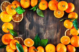 Frame of fresh ripe tangerines with, a Food & Drink Photo by Kate S