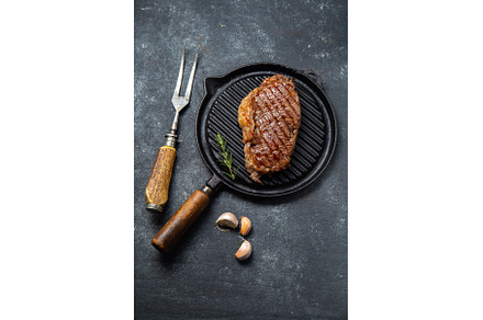 Fried strip loin steak on vintage, a Food & Drink Photo by LARISA BLINOVA