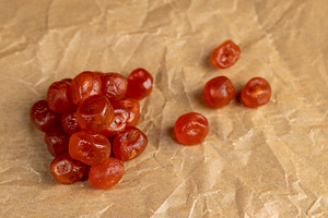 boiled with sugar syrup candied fruits of small fruits of kumquat, a Photo by rsoollAI