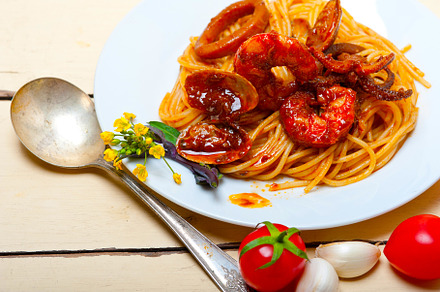 Italian seafood spaghetti pasta on red tomato sauce, a Food & Drink Photo by keko64